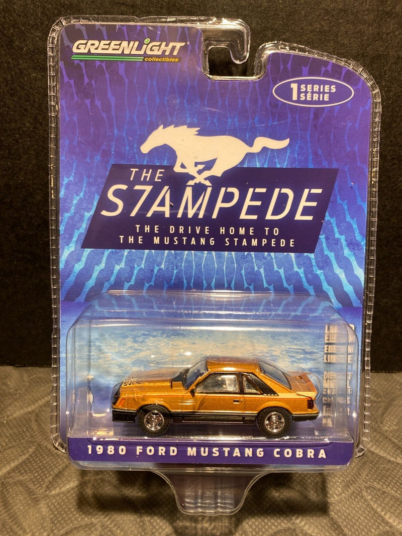1/64 GREENLIGHT THE STAMPEDE 1980 FORD MUSTANG COBRA HATCHBACK GOLD